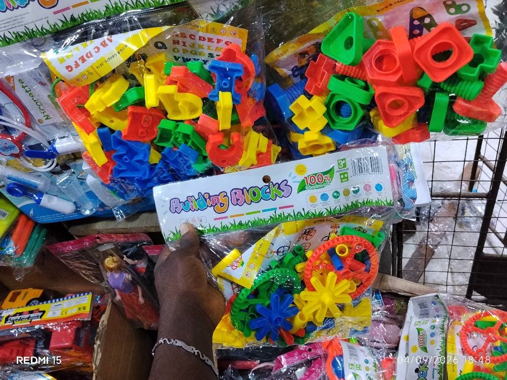 Children building black and car and bank sev